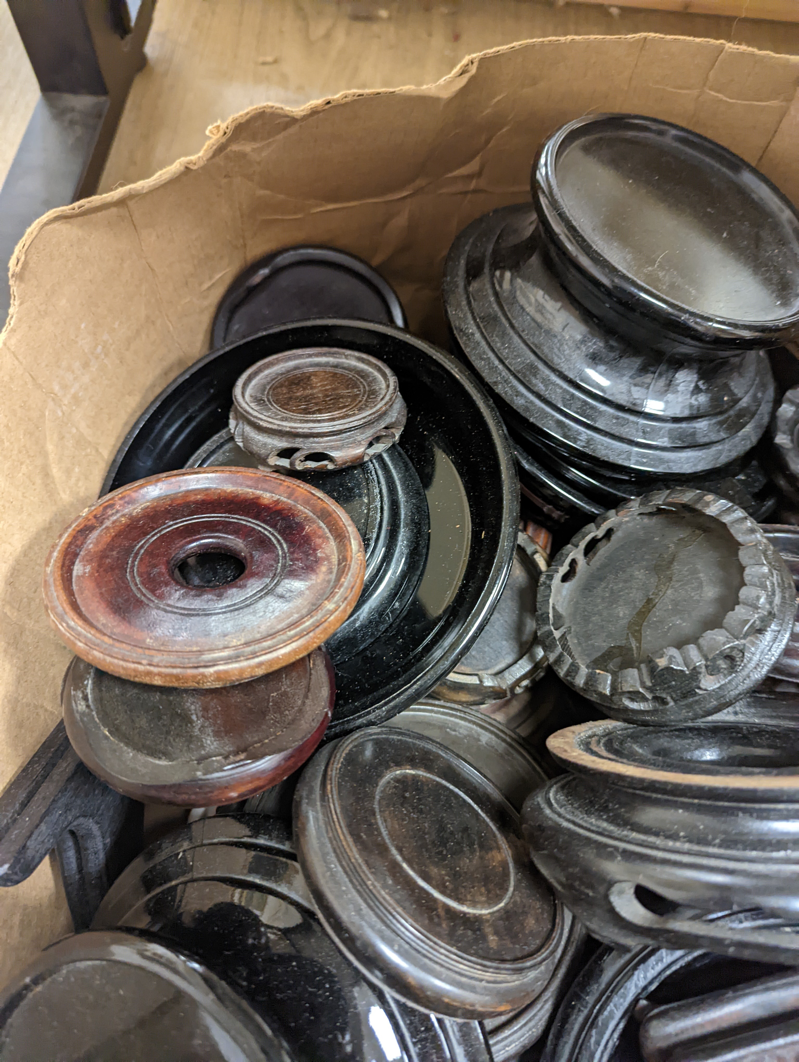 Three boxes of hardwood, glass and ceramic stands.